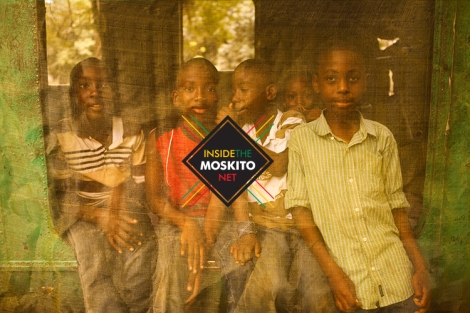 kids inside the moskito net